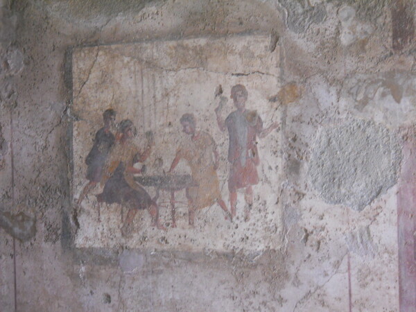 Un immagine di giocatori ad una caupona (osteria) in via Mercurio a Pompei dove si gioca a tabula. (credit: archivio personale di Monica Silvestri)